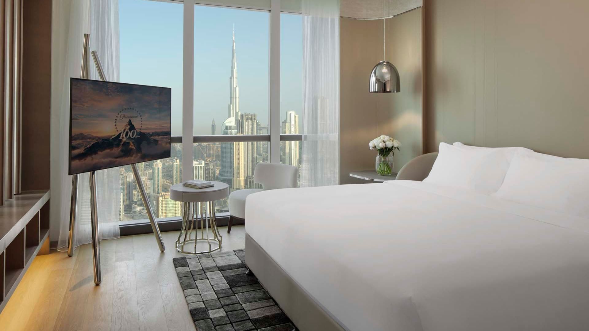 King bed in Silver Screen Suite with a city view at Paramount Hotel Dubai