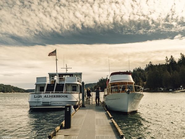 2 boats docked in the Waterfront at Alderbrook Resort & Spa