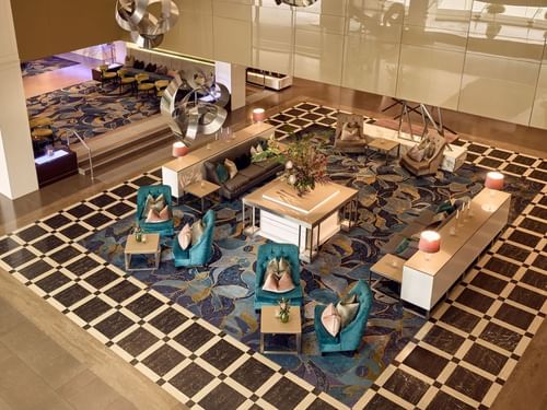 Sofitel Brisbane Central hotel lobby with plush seating and decorative floor pattern