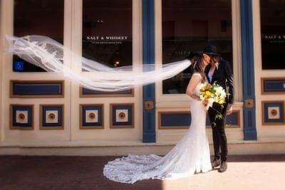 A wedding couple kissing at Horton Grand Hotel
