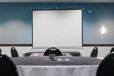 Screen, arranged tables, Summit Room A & B, Aava Whistler Hotel