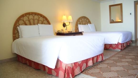 Twin beds in Perla Ocean View Double at Mundo Imperial
