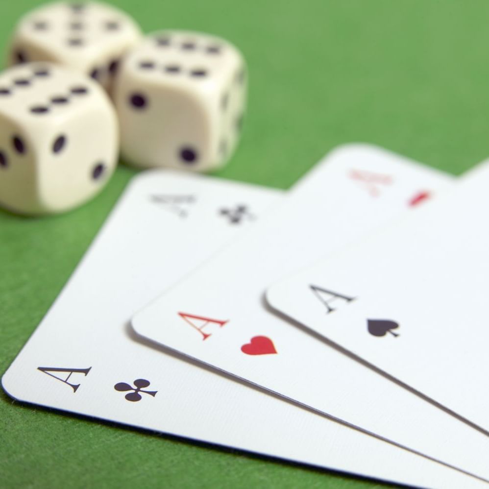 Casino cards & dice arranged on The Roof at Costa Beach Resort