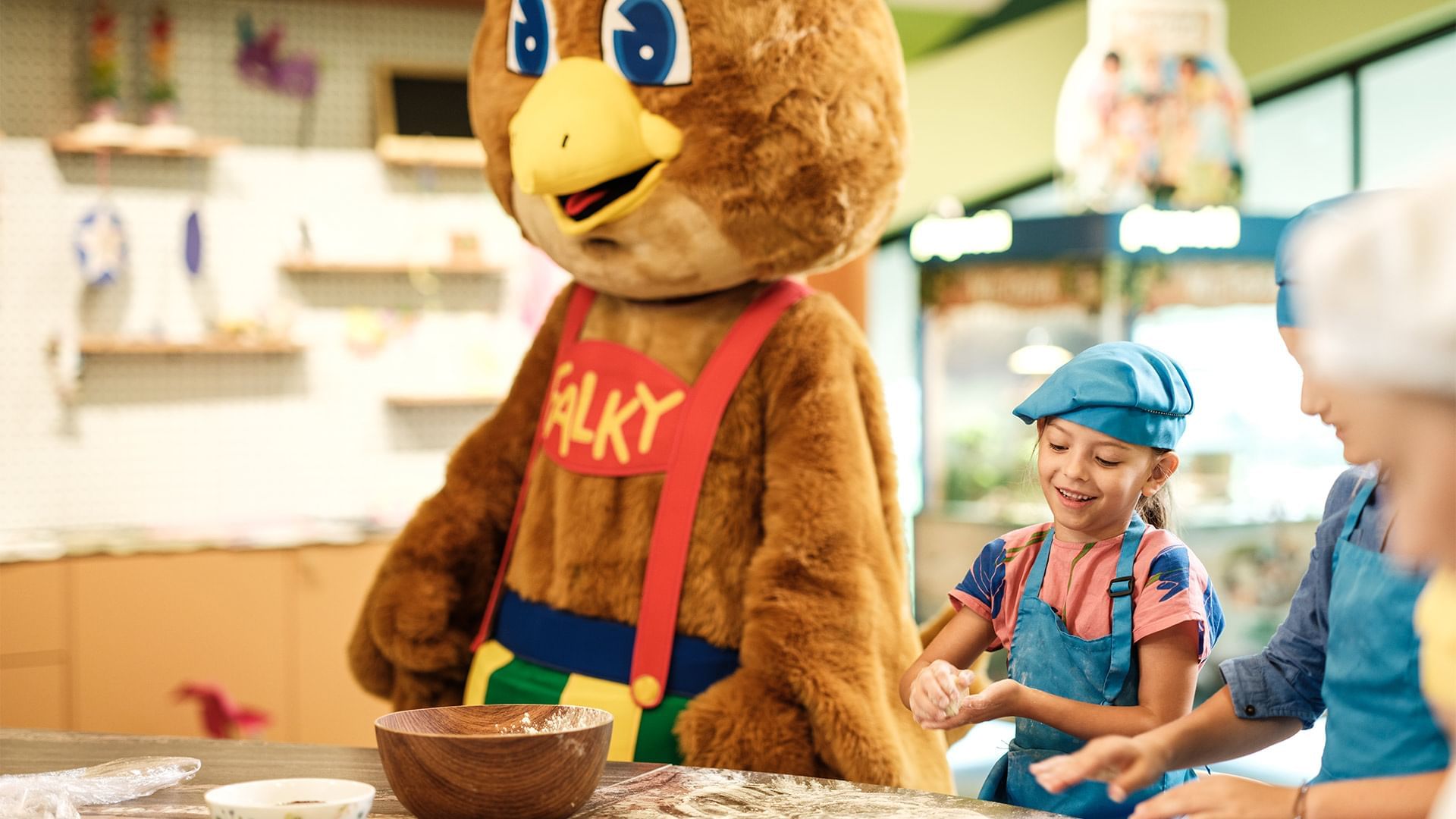 Children making dough with a mascot at Falkensteiner Family Resort Sicily