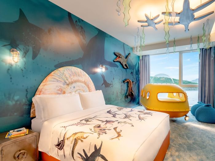 Cozy bed and sitting area in Jurassic Submarine Room at Fullerton Ocean Park Hotel Hong Kong