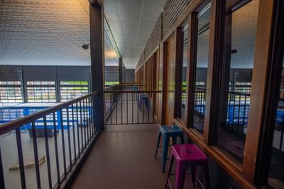 two chairs on an indoor balcony