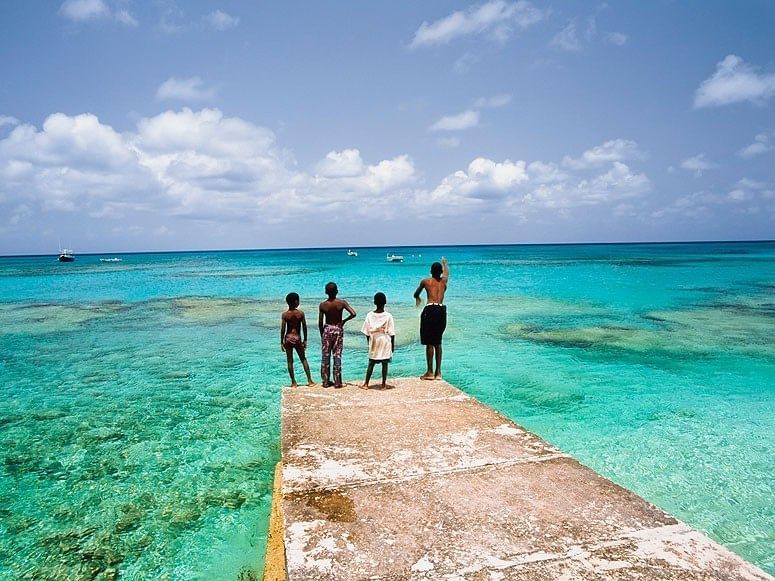 Kids by the Grace Bay Beach near The Somerset on Grace Bay