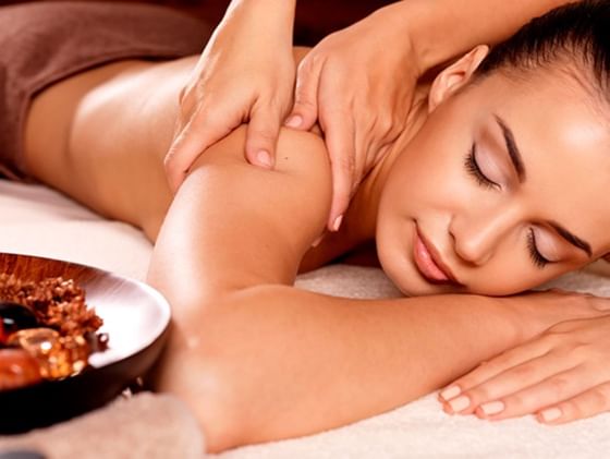 A lady having a massage in Plaza Pelicanos Club Beach Resort