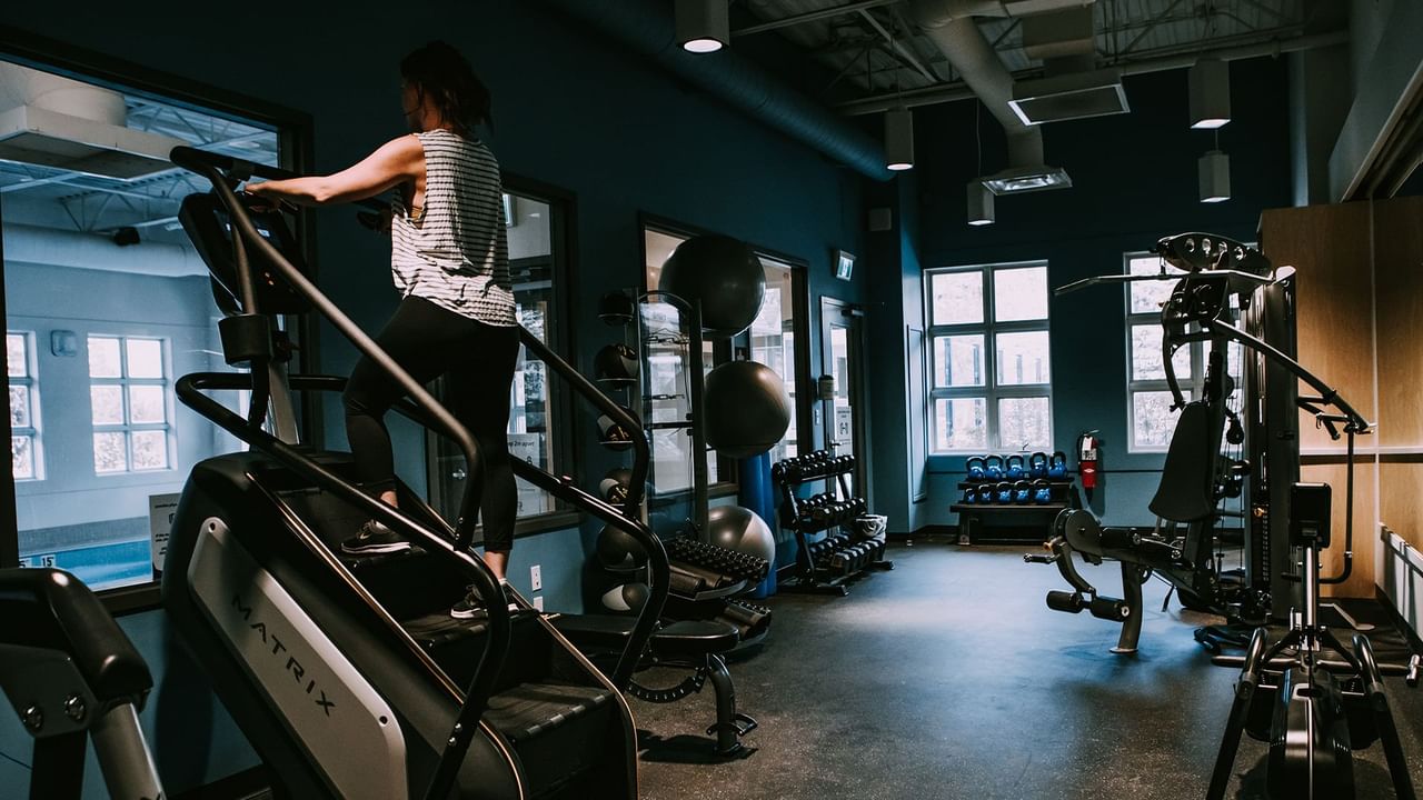 Hotel gym with various exercise equipment.