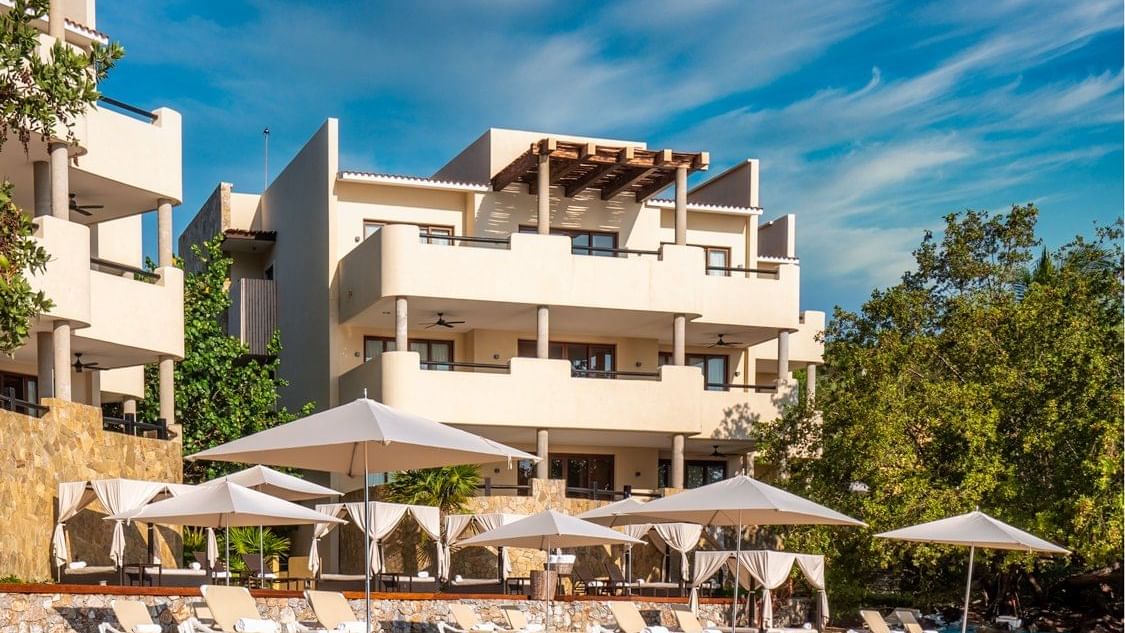 Exterior view with sun beds Celeste Beach Residences Curamoria