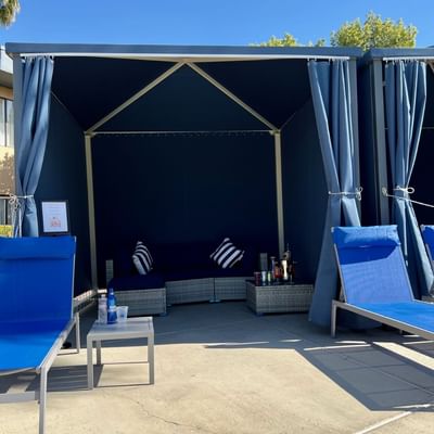 Comfy lounges in the outdoor Pool cabanas at Alexis Park Resort