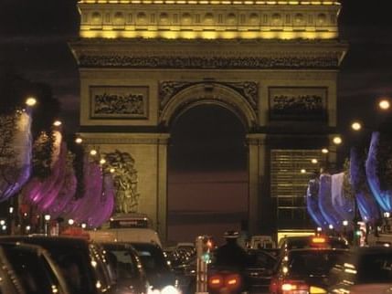 View of Champs-Élysées at night near Hilton Paris Opera Hotel
