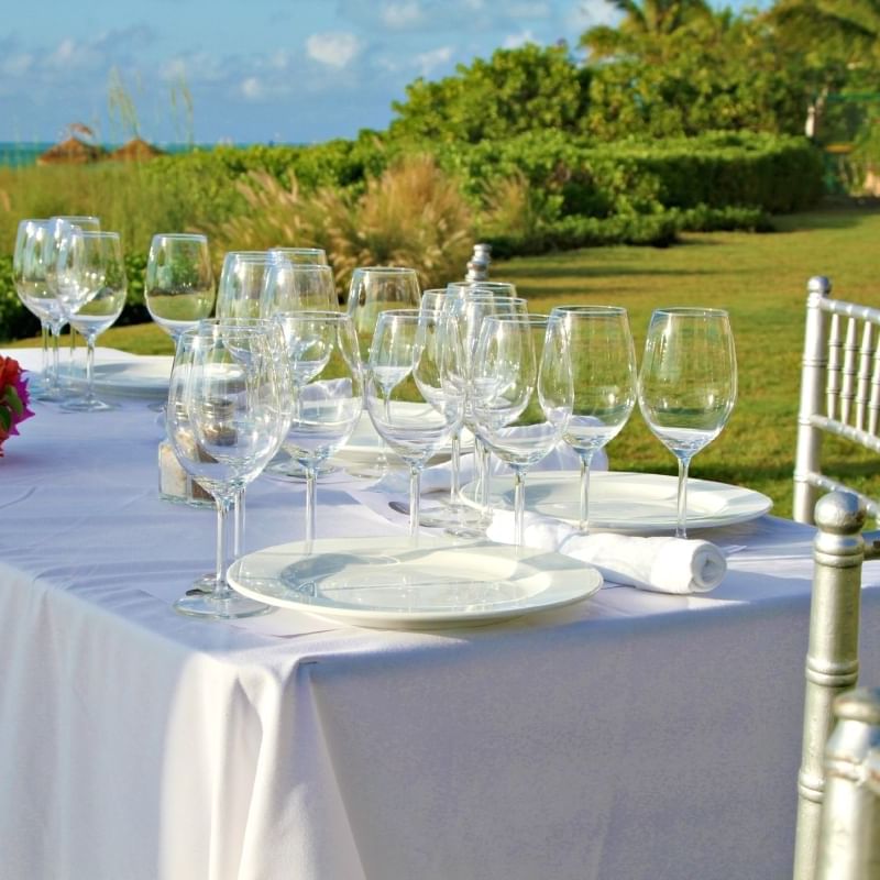 Table set-up for an event outdoors at The Somerset on Grace Bay