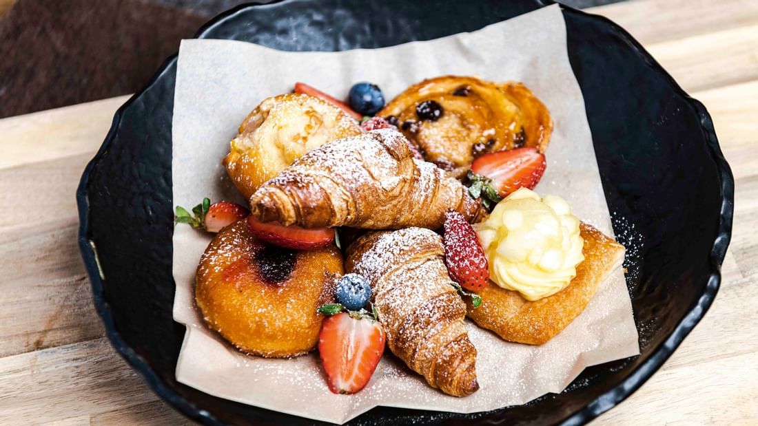 Pastries with powdered sugar and berry being served for breakfast at The Ternary in Novotel Sydney on Darling Harbour