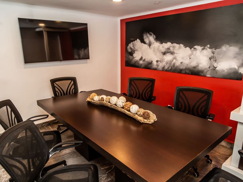 Boardroom set-up, wall art & TV in a Business Center at Gamma Puebla Señorial Centro