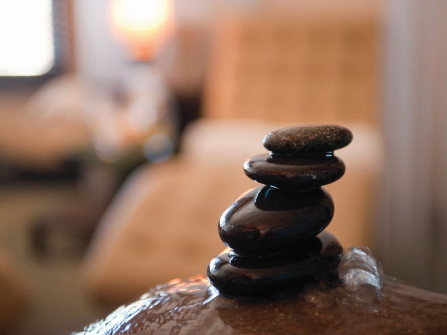 Closeup of Zen basalt stones in spa room at Chase on the Lake