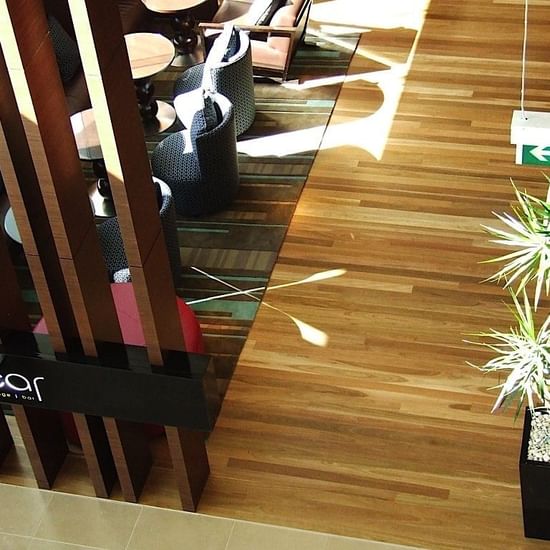 Lobby lounge area with wooden floors at Pullman Olympic park