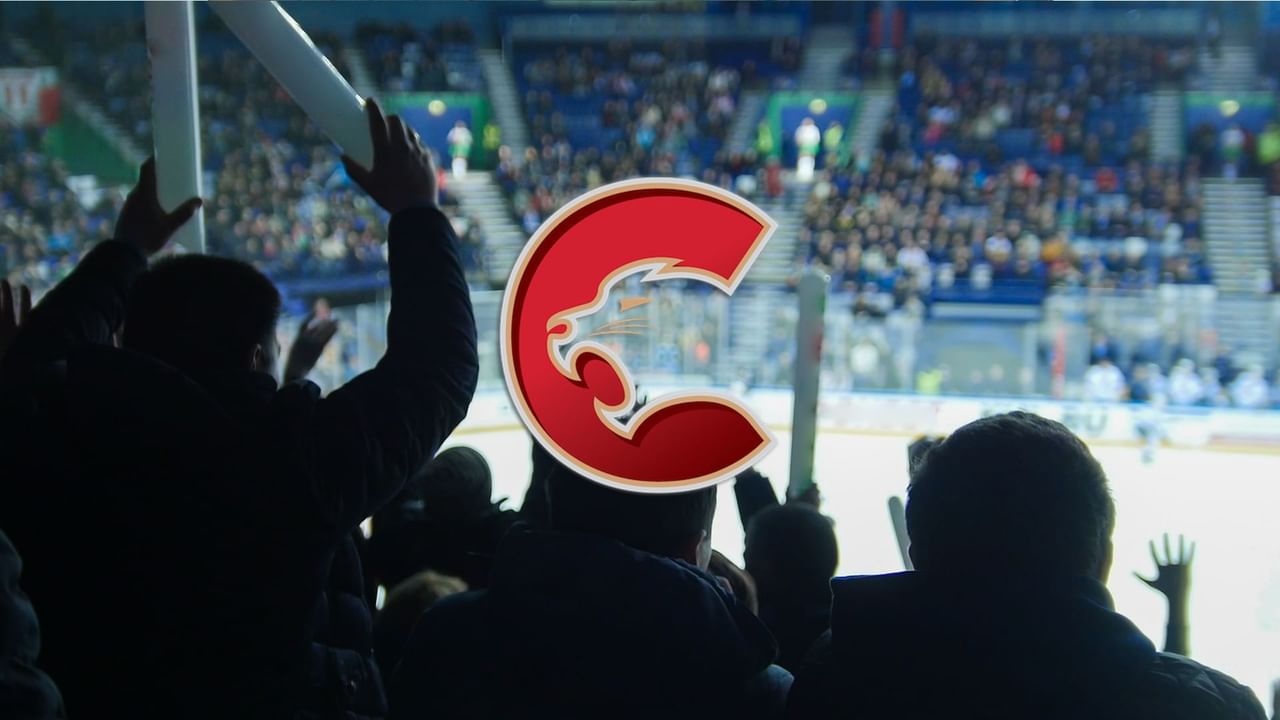 Hockey fans cheering with Prince George Cougars logo