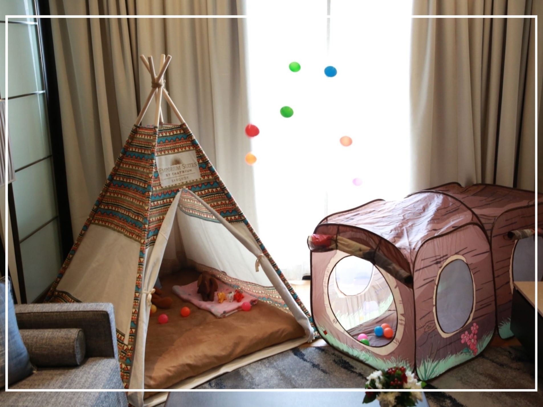 Kid's play equipment in a Family Room at Emporium Suites