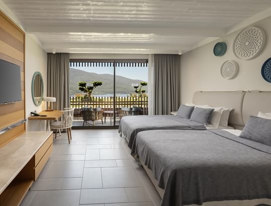 Standard Partial Sea View Room with two beds and a balcony at Titanic Luxury Collection Bodrum.