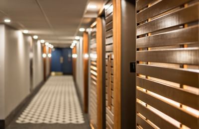 Corridor with wooden paneling at Embassy Hotel & Suites Ottawa