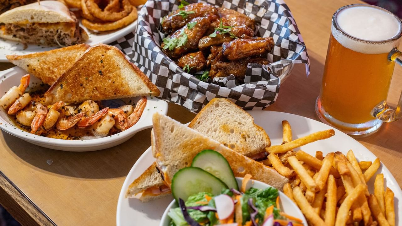 Wings, fries, salad, sandwiches, and beer