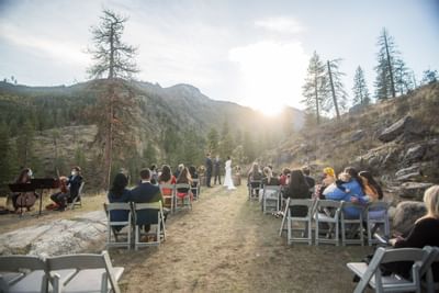 People at an outdoor wedding ceremony at Sleeping Lady