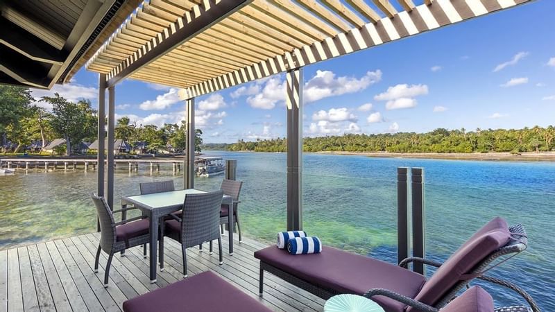 Dining & lounge area in Overwater Villas at Warwick Le Lagon