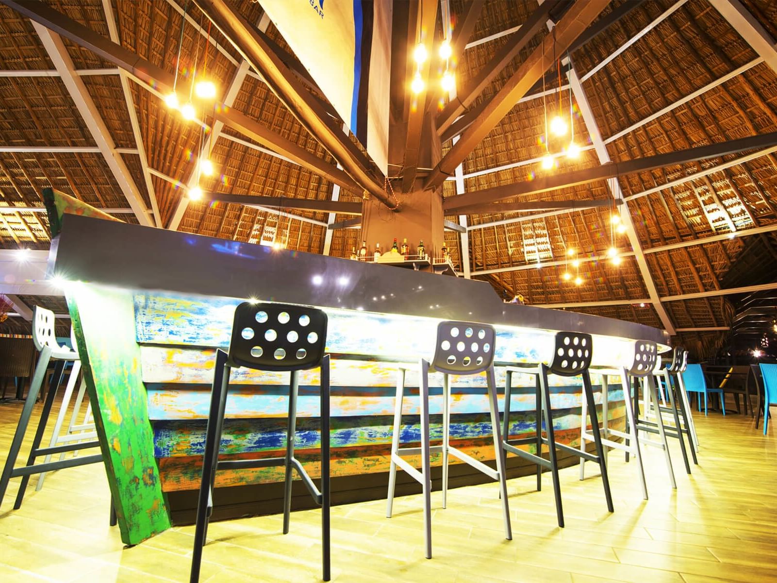 Elegant interior of Main Bar El Mastil with bar stools at Fiesta Resort