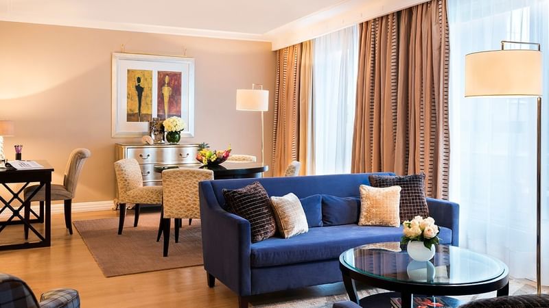 Spacious living area with cozy couches in The Champs-Élysées Suite at Warwick Paris Champs Elysées