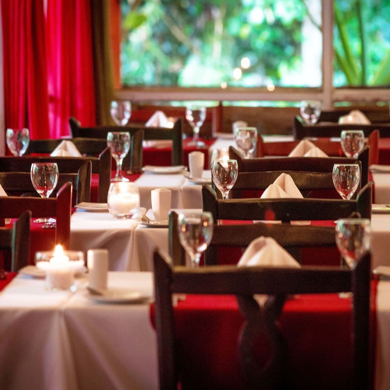 Tables arranged for dining in the La Cantera Lodge de Selva