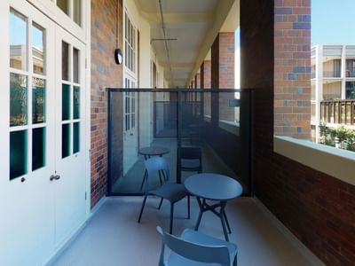 Twin Room Balcony with table and chairs at UniLodge Herston.