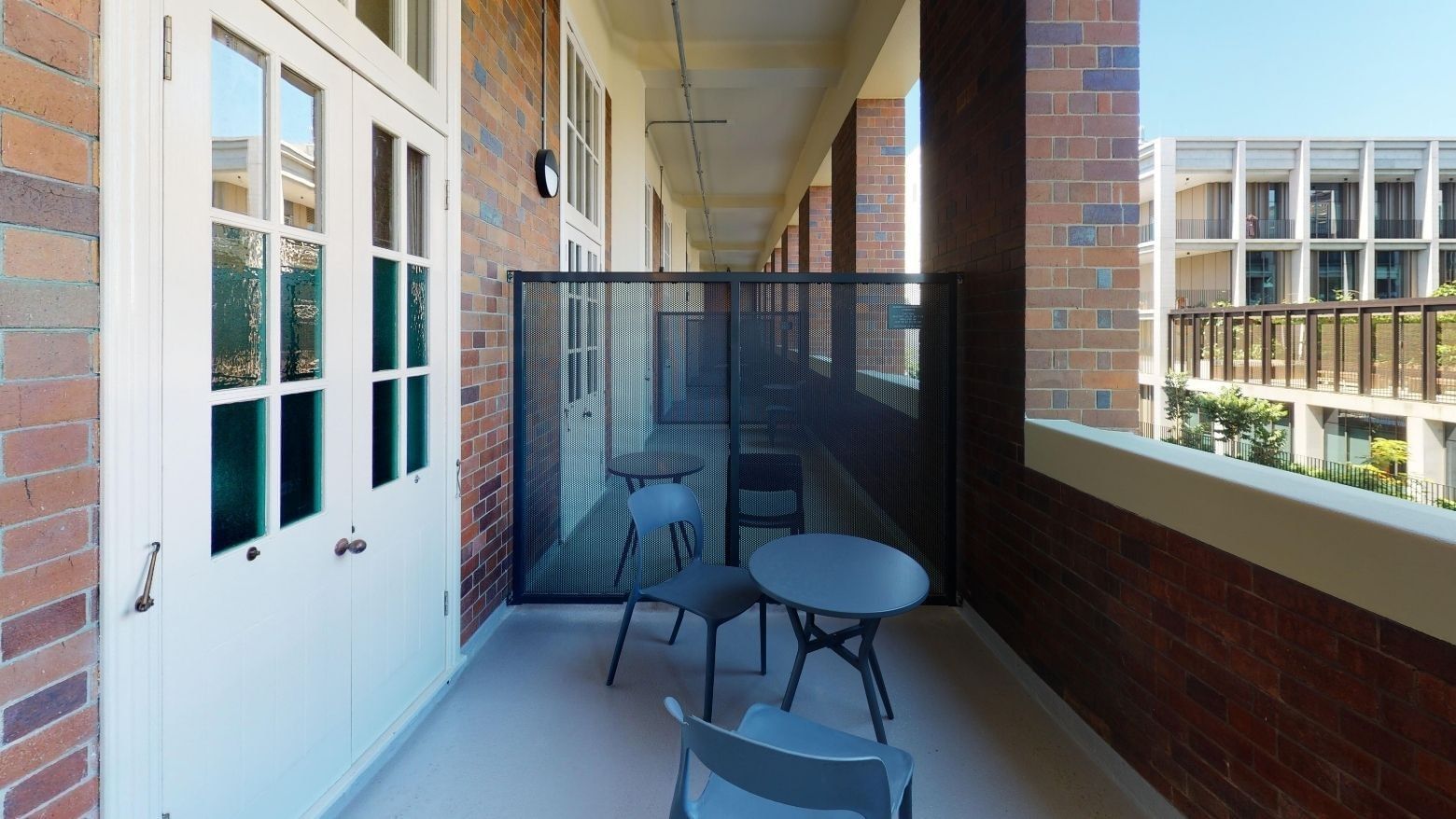 Twin Room Balcony with table and chairs at UniLodge Herston.