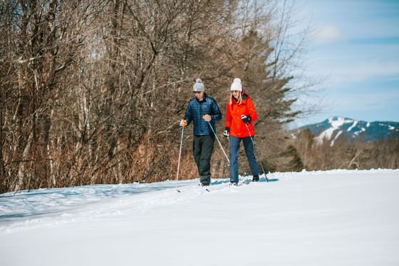 Two people skiing near Topnotch Stowe Resort