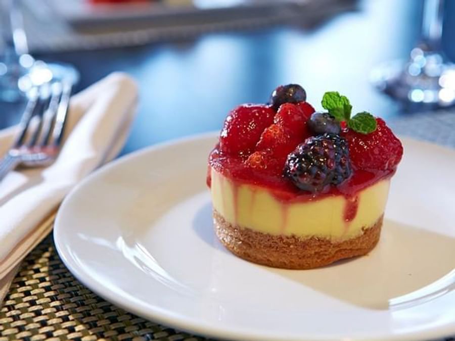 Mini cheesecake with fresh berries, placed on a table at Warwick Allerton Chicago