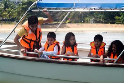Few people on a boat ride in the beach