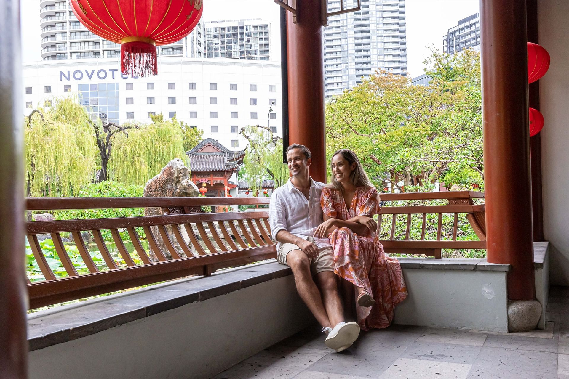 Couple enjoying a garden view at Novotel Sydney Darling Square