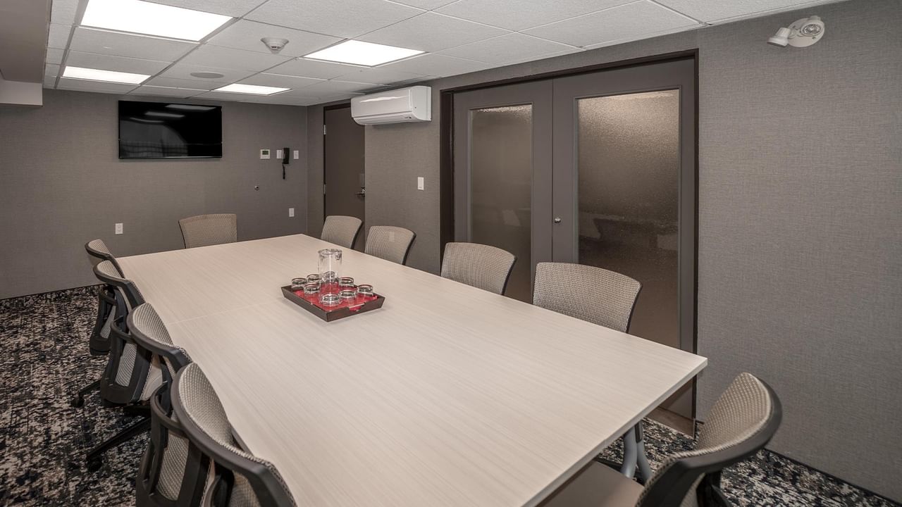 Meeting room with a long table and chairs