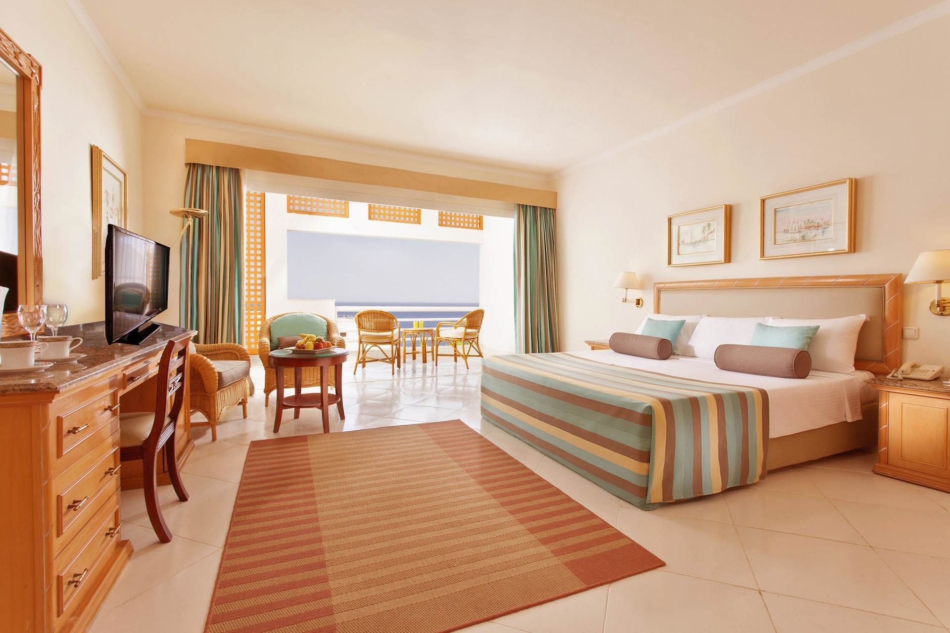 Sea View Grand Suite with bed, furnishings, TV & seating area at Pickalbatros Golf Beach Resort, Beach Sharm El Sheikh
