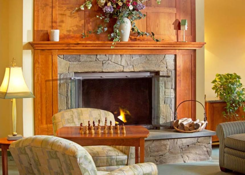 Living area with fireplace at Gorges Grant Hotel by Ogunquit Collection