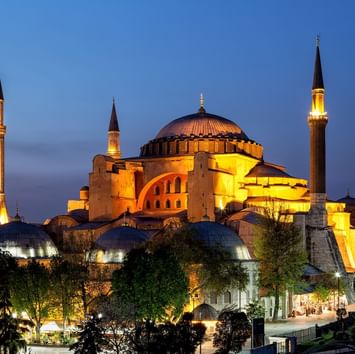 Distant view of the Hagia Sophia Grand Mosque at night near Titanic Business Kartal