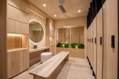 Locker area with wooden benches, and lockers at Villa Premiere Boutique Hotel & Romantic Getaway