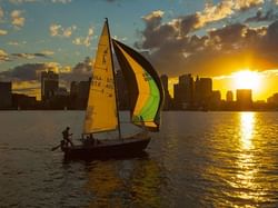 a person sailing a sail boat