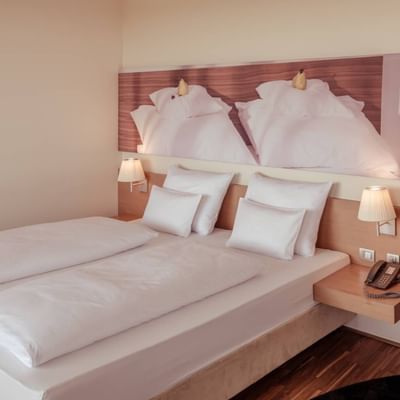 Comfy bed in Spa Suite with Sauna, Falkensteiner Balance Resort