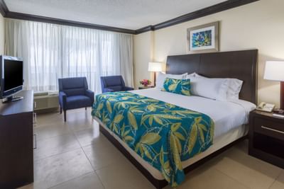Cozy double bed in a Rosehall Room at Holiday Inn Montego Bay