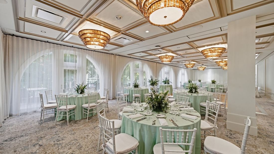 La Terraza Ballroom with elegant decor and round tables at el PRADO Hotel in Palo Alto.
