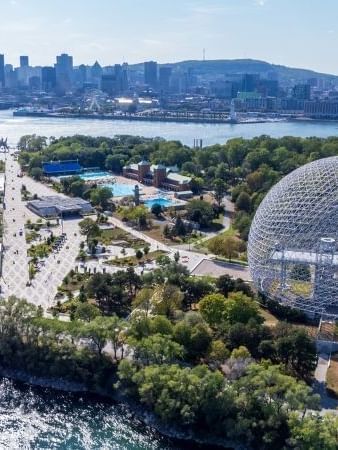 Aerial view of the Biosphere dome and surrounding parkland near Warwick Le Crystal Montreal