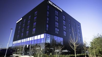 Exterior view of Village Hotel Portsmouth with rooftop sign