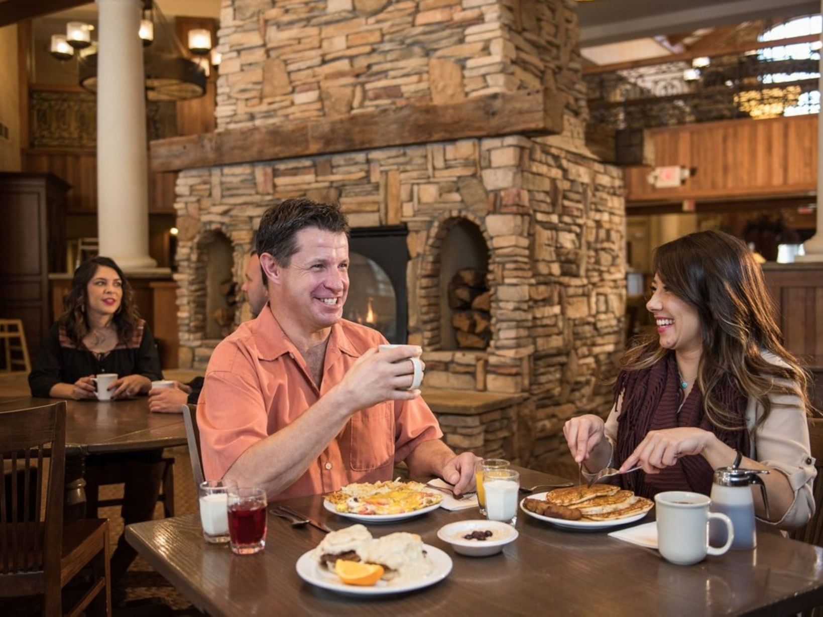 Couple enjoying Breakfast served at MCM Elegante Lodge Ruidoso