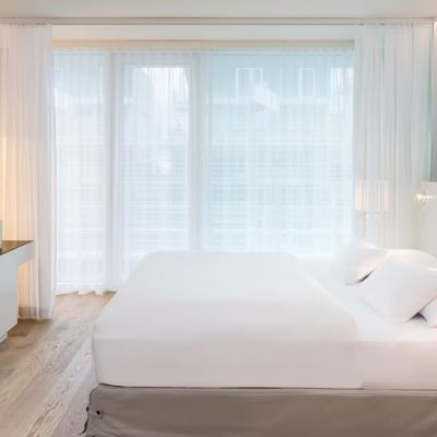 Bed in Dreamaway Penthouse sea view at Falkensteiner Hotels